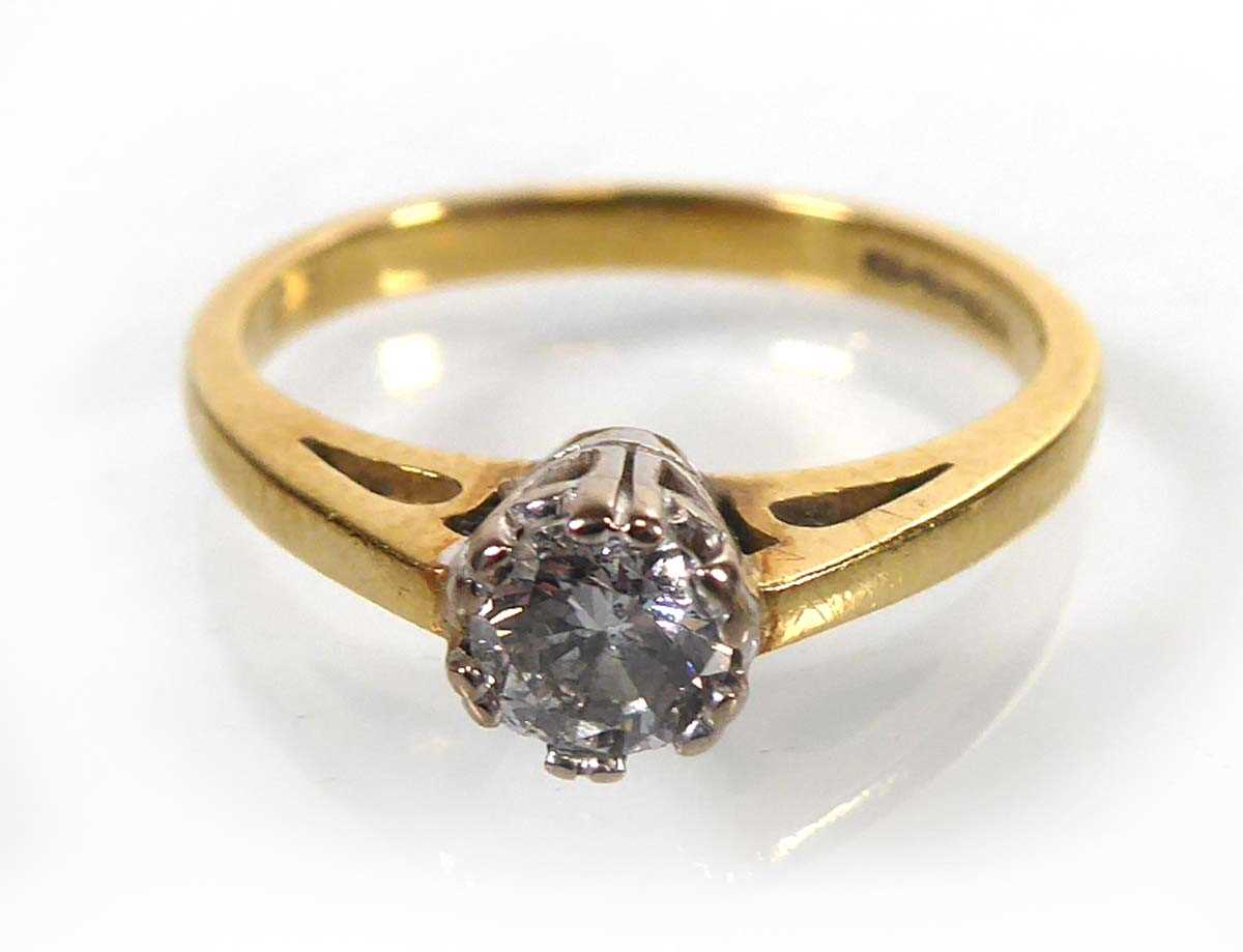 Lot An 18ct yellow gold ring set brilliant cut...