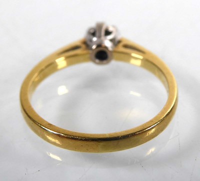 Lot An 18ct yellow gold ring set brilliant cut...