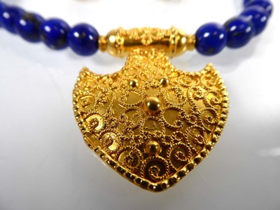 Lot 811 - A single strand lapis lazuli bead necklace...