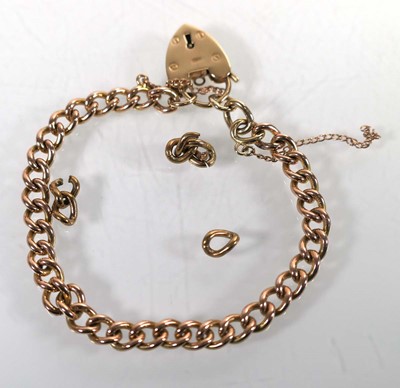 Lot A 9ct yellow gold curblink bracelet with heart...