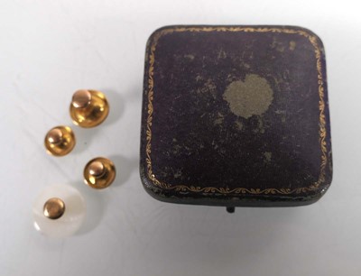 Lot A set of three 9ct yellow gold dress studs,...