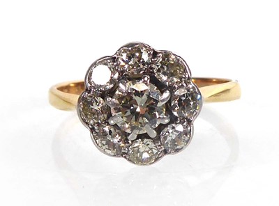 Lot An 18ct yellow gold cluster ring set nine...