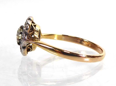 Lot An 18ct yellow gold cluster ring set nine...