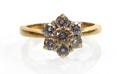 Lot An 18ct yellow gold cluster ring set seven...