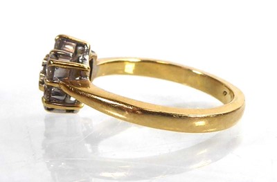 Lot 813 - An 18ct yellow gold cluster ring set seven...