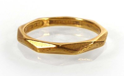 Lot A 22ct yellow gold facet decorated wedding...