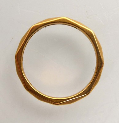 Lot A 22ct yellow gold facet decorated wedding...