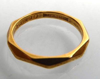 Lot A 22ct yellow gold facet decorated wedding...