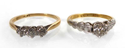 Lot An 18ct yellow gold ring set three small...