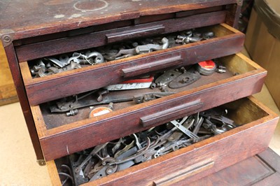 Lot 1313 - Two wooden sets of drawers containing various...