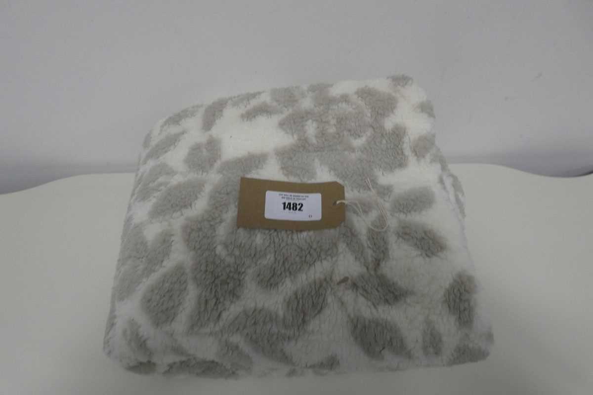 Lot 1482 - A Life Comfort patterned throw in beige and...