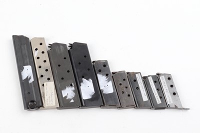 Lot 1102 - Nine pistol magazines: 2 x .45 Colt; 9mm Luger;...