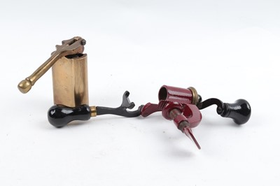 Lot 1126 - 12 bore iron and brass bench top roll turn...