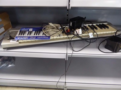 Lot 2301 - Roland ED PC180A keyboard with chargers,...