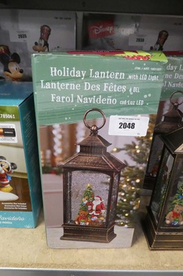 Lot 2048 - Pair of battery operated snow globe style...