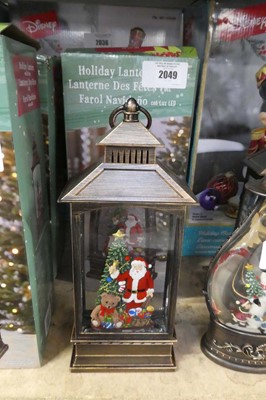 Lot 2049 - Pair of battery operated snow globe style...