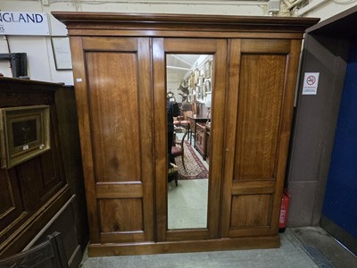 Lot 43 - A Victorian mahogany triple wardrobe having...