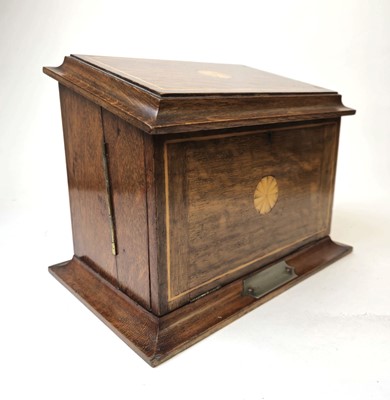 Lot 302 - An Edwardian oak, strung and marquetry desk...