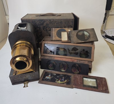 Lot 322 - A black tole and brass magic lantern,...