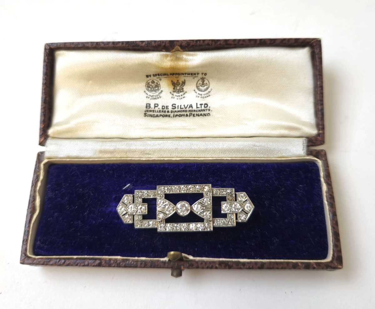 Lot 583 - An Art Deco white metal and diamond brooch of...