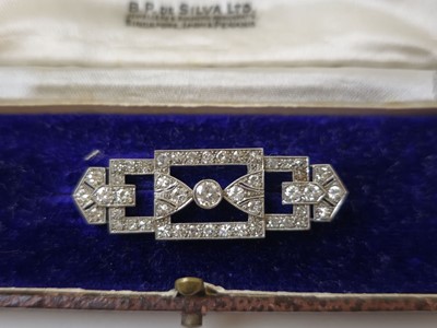 Lot 583 - An Art Deco white metal and diamond brooch of...