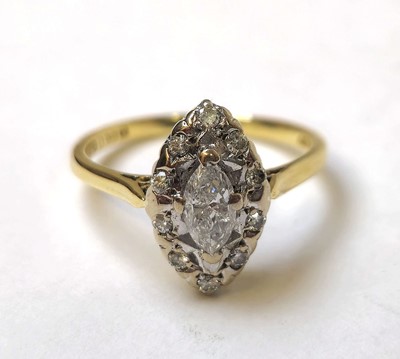 Lot 584 - An 18ct gold and marquise shaped diamond...