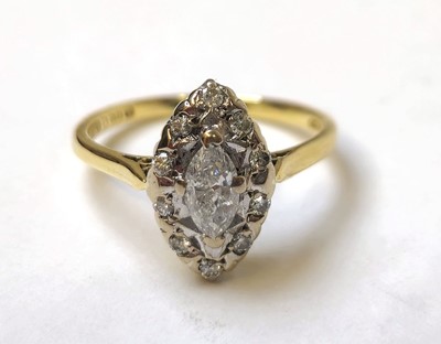 Lot 584 - An 18ct gold and marquise shaped diamond...