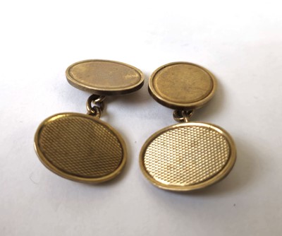 Lot 589 - A pair of 9ct gold cufflinks with engine...