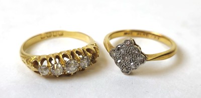 Lot 591 - A yellow metal and diamond cluster ring marked...