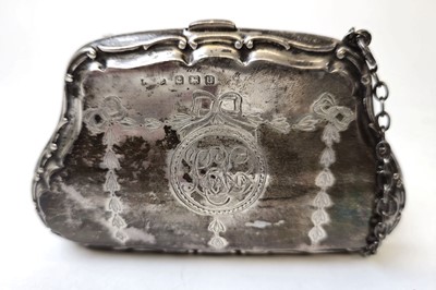 Lot 408 - A George V silver purse with engraved floral...