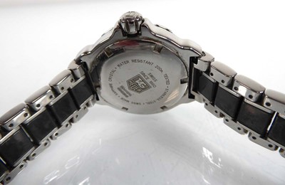 Lot 448 - A ladies stainless steel and black enamel...