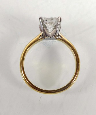 Lot An 18ct yellow gold ring set princess cut...