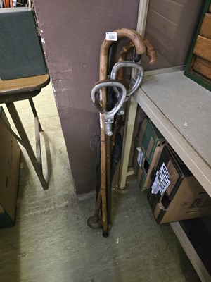 Lot 300 - Two shooting sticks along with two umbrellas...