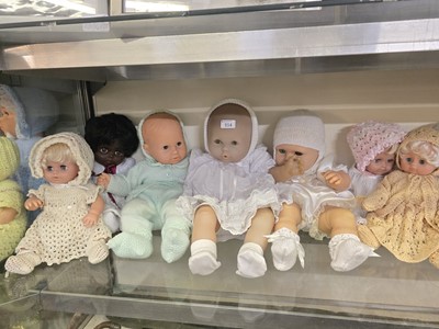 Lot 314 - An assortment of fourteen baby dolls in...