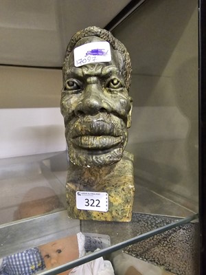 Lot 322 - An African carved stone bust of a gentleman