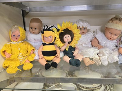 Lot 323 - An assortment of twelve baby dolls with...