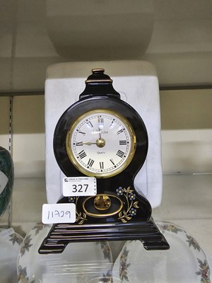 Lot 327 - A black ceramic Westclox quartz mantel clock