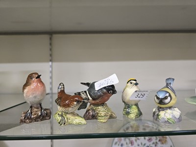 Lot 329 - Five ceramic figurines of birds consisting of...