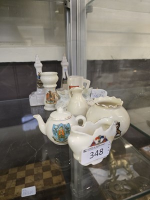 Lot 348 - An assortment of nine pieces of ceramic...