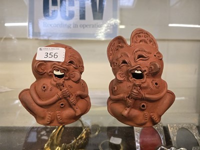 Lot 356 - A pair of abstract clay figures of comical...