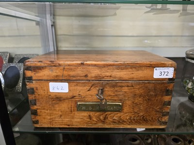 Lot 372 - A wooden workbox containing an assortment of...