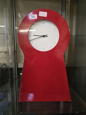 Lot 391 - A red metal wall mounted cabinet in the form...