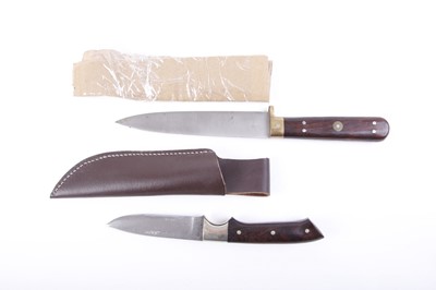 Lot 80 - Two sheath knives: 6 ins single edged blade...