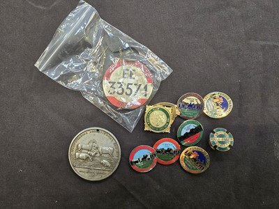 Lot 404 - A bag containing a quantity of badges relating...