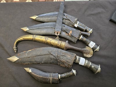 Lot 419 - A collection of five kukri knives