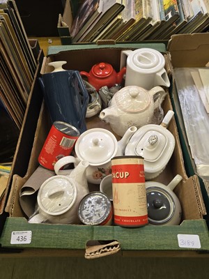 Lot 436 - A tray containing teapots, old tins, etc