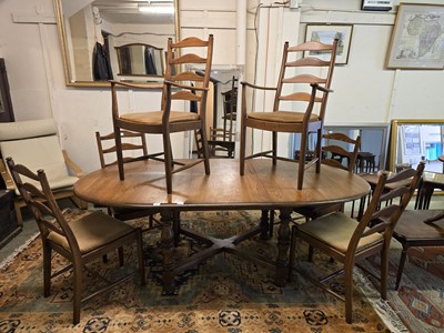 Lot 14 - A modern light Ercol extending dining table...