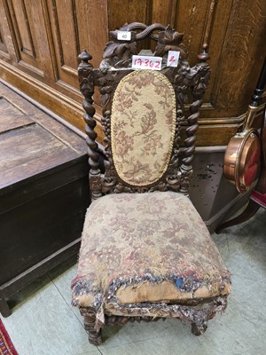 Lot 40 - A late 19th century oak carved back hall chair...