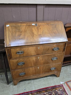 Lot 48 - An early 20th century walnut fall front bureau...