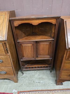 Lot 50 - An Edwardian walnut corner cabinet having open...